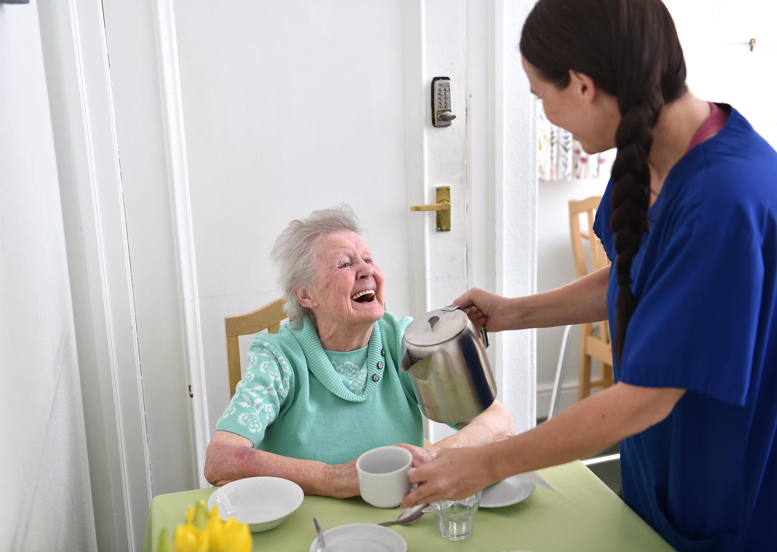 Residents laughing and enjoying a social activity