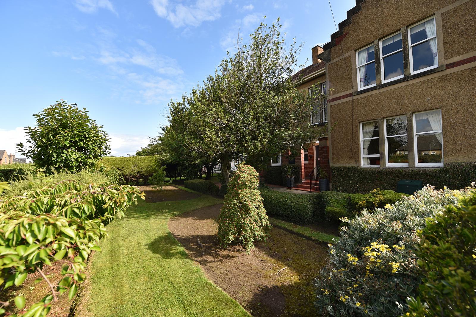 Gallery image of a resident enjoying the garden